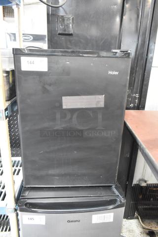 Haier HC27SF10RB mini cooler, black, 115V, used; visible scratches and wear. Model label intact.