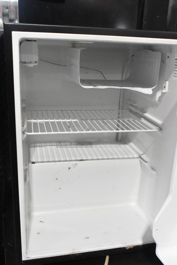 Haier HC27SF10RB Mini Cooler, 115V, 1 Phase, wire shelf, white interior, some wear visible.