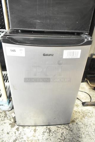 Galanz GL43S5 Mini Cooler, 115V, stainless steel finish. Visible labels: "145, QTY 1". Some surface wear.