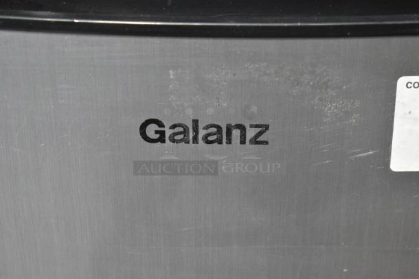 Galanz GL43S5 mini cooler, brushed metal finish, 115 volts, model label visible, slight surface wear.