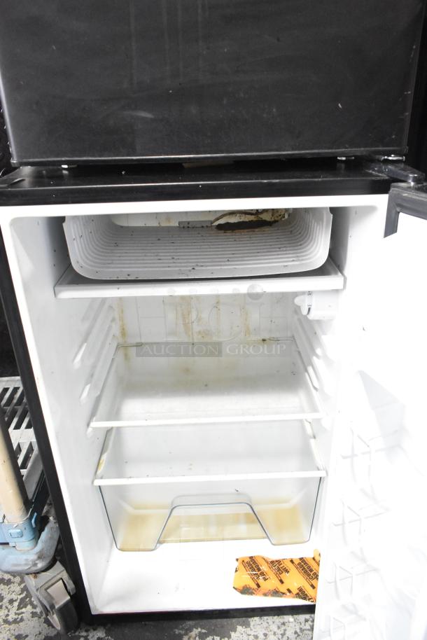 Galanz GL43S5 mini cooler, 115 volts, 1 phase, visible wear and stains, empty interior with shelving and a small bottom drawer.