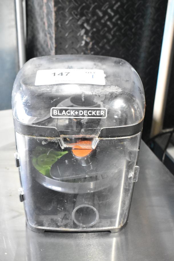 Black & Decker food processor blades in a hard case, clear lid, visible wear, labeled with item number 147.