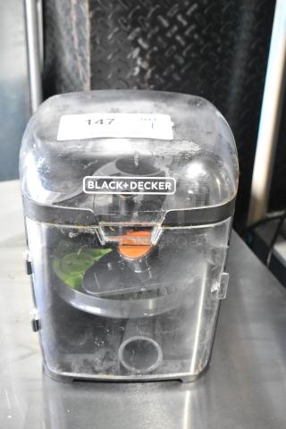 Black & Decker food processor blades in a hard case, clear lid, visible wear, labeled with item number 147.
