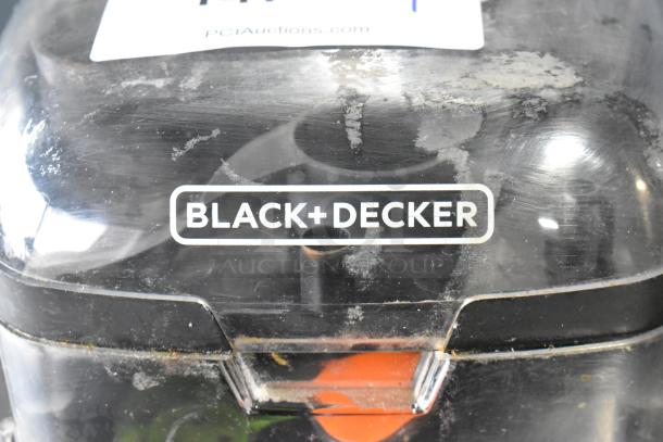 Black & Decker food processor accessories in hard case showing the brand logo. Slightly worn exterior.