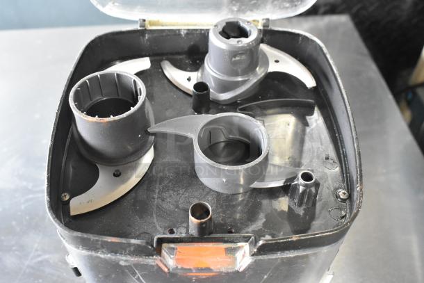 Black & Decker food processor blades and accessories in a hard case, showing various attachments, moderate wear.