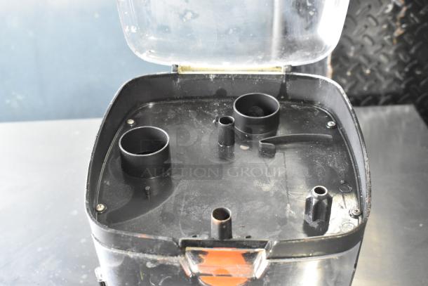 Black & Decker food processor accessories with blades in a hard case. Case features molded blade slots and a clear lid.