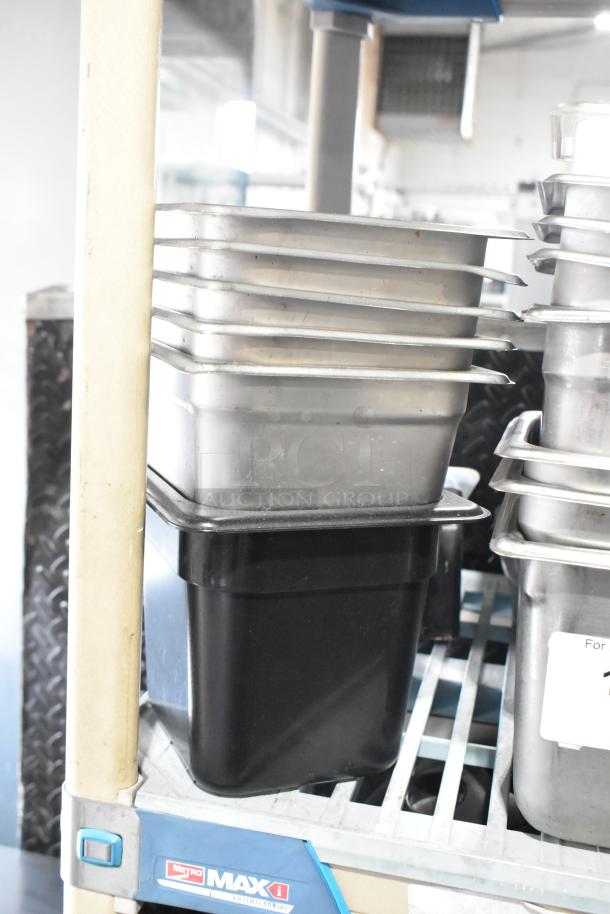 ALL ONE MONEY! Tier lot with stainless steel and poly bins on a Metro MAX antimicrobial shelf.