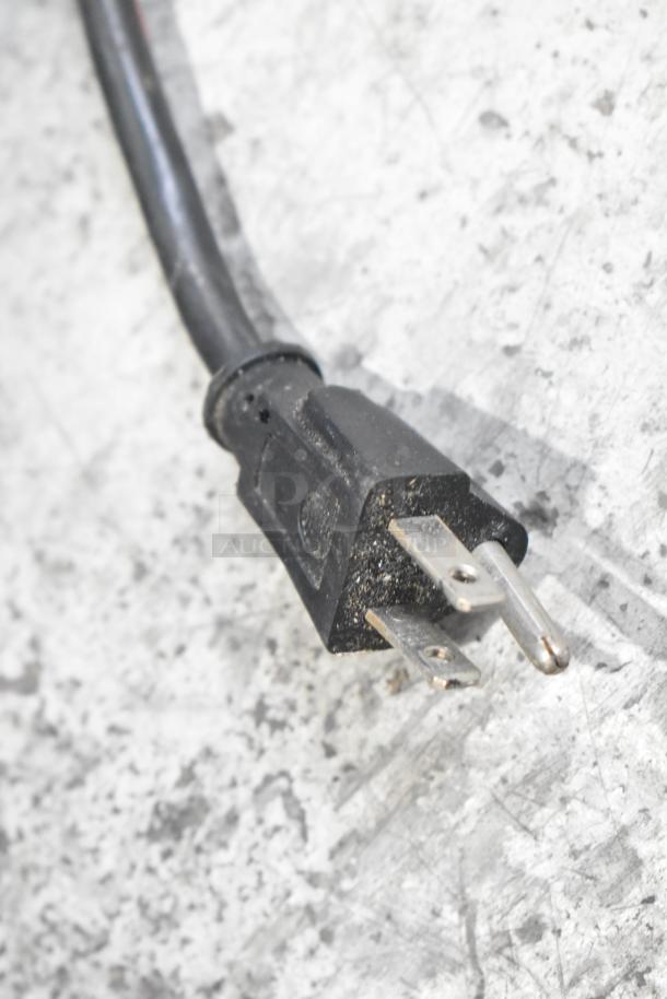 Close-up of a power plug for the LED-2 Light Up Sign, 120 Volts, 1 Phase. Black cord, standard three-prong plug.