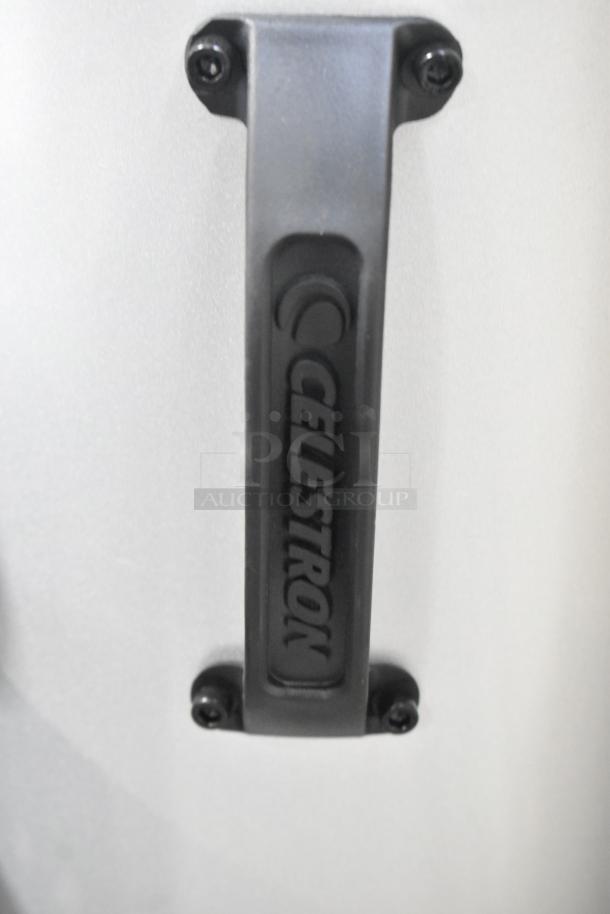 Celestron StarSense 22470 Explorer DOB Telescope handle. Durable build, aperture 203mm, focal length 1200mm. Logo visible.