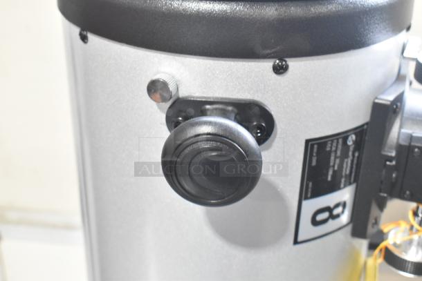 Celestron StarSense 22470 Explorer DOB Telescope, 203mm aperture, 1200mm focal length. Close-up of adjustment knob and identification label.