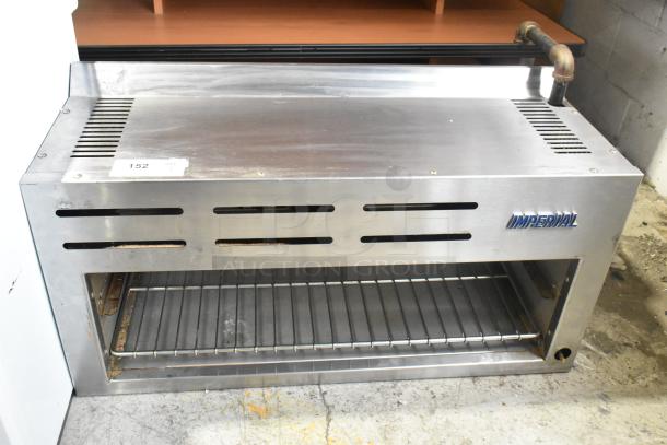 Imperial ICMA-36 Stainless Steel Cheese Melter, natural gas, commercial model, side vent slots, blue brand logo, moderate wear.