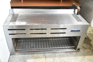 Imperial ICMA-36 Stainless Steel Cheese Melter, natural gas, commercial model, side vent slots, blue brand logo, moderate wear.
