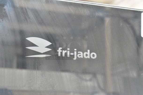 Fri-jado TDR 7-P stainless steel commercial rotisserie oven with logo, electric, 208V, 3-phase, on casters.