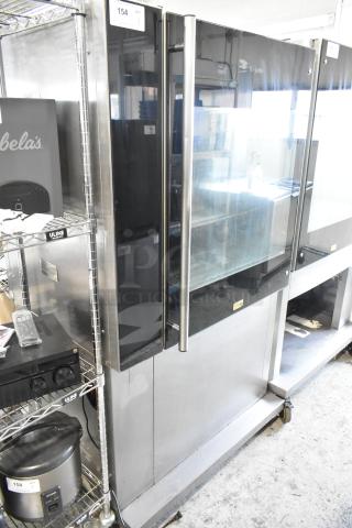Fri-jado TDR 7-P stainless steel commercial rotisserie oven on casters, electric 208V, 3-phase, visible brand logo.