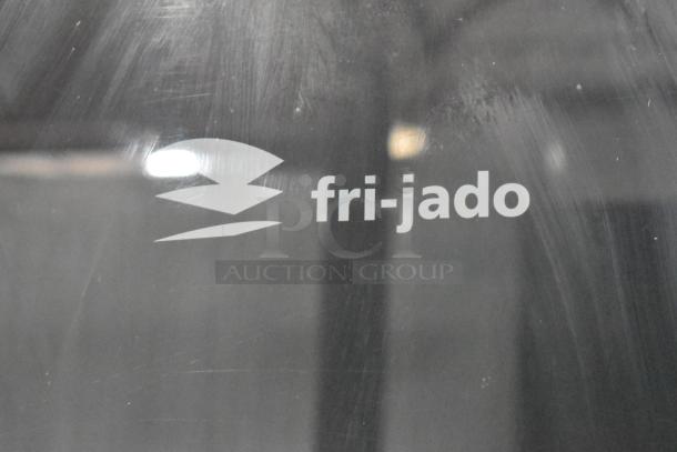 Fri-jado TDR 7-P logo on stainless steel commercial electric rotisserie oven. Features 208V, 3-phase power, on casters.