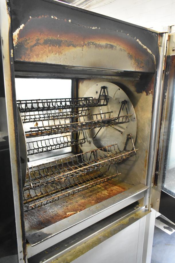 Fri-jado TDR 7-P stainless steel rotisserie oven, commercial floor style, electric, visible wear, on casters.