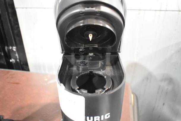 2024 Keurig Single Cup Coffee Machine, black, open top view. 120 Volts, 1 Phase. Appears in good condition.