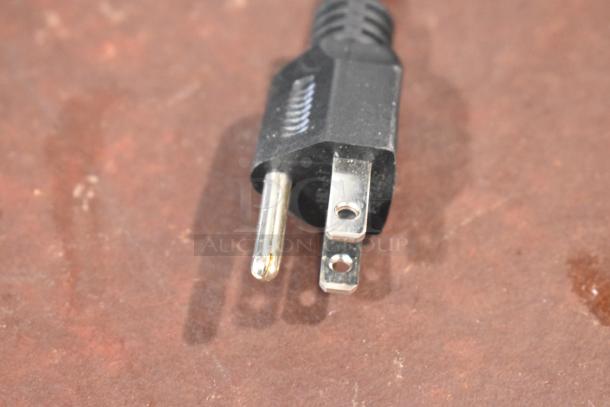 Close-up of a black power plug for a 2024 Keurig Single Cup Coffee Machine, 120 Volts, 1 Phase.