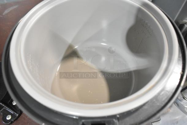 Tiger JNP-S10U Rice Cooker, interior view showing non-stick inner pot. Model markings visible. Good condition. 120V.