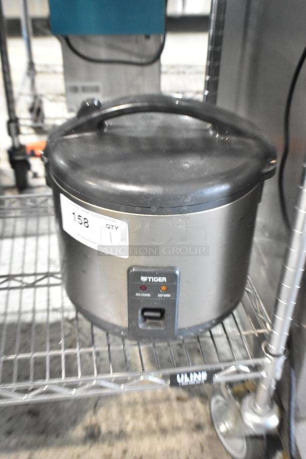 Tiger JNP-S18U Rice Cooker/Warmer, 120 Volts, 1 Phase, stainless steel exterior, used condition, visible control panel.