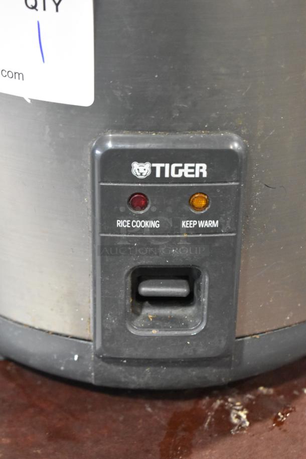 Tiger JNP-S18U rice cooker/warmer, dual settings for cooking and warming, 120V, visible wear, sturdy build.
