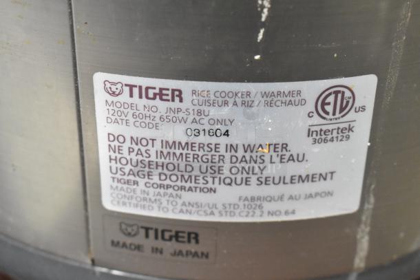 Tiger JNP-S18U Rice Cooker/Warmer label. Features 120V, 650W, made in Japan. Warning: Do not immerse in water. Household use only.