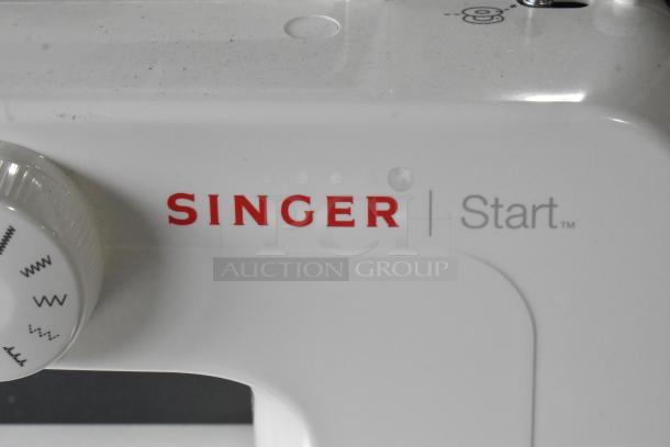 Singer Start countertop sewing machine, white, with foot pedal. Features stitch selection dial. Model uses 120 volts, 1 phase.
