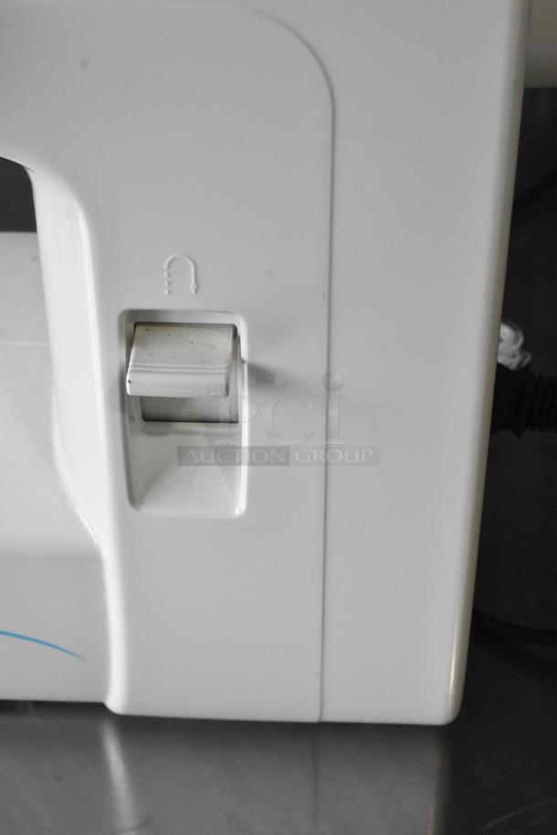 Singer countertop sewing machine with visible control switch. Includes foot pedal. Operates at 120 volts, 1 phase.