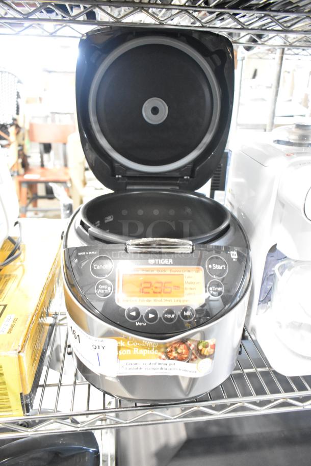 Tiger JKT-D18U countertop rice cooker/warmer, 120V, lid does not close, visible digital display, made in Japan.