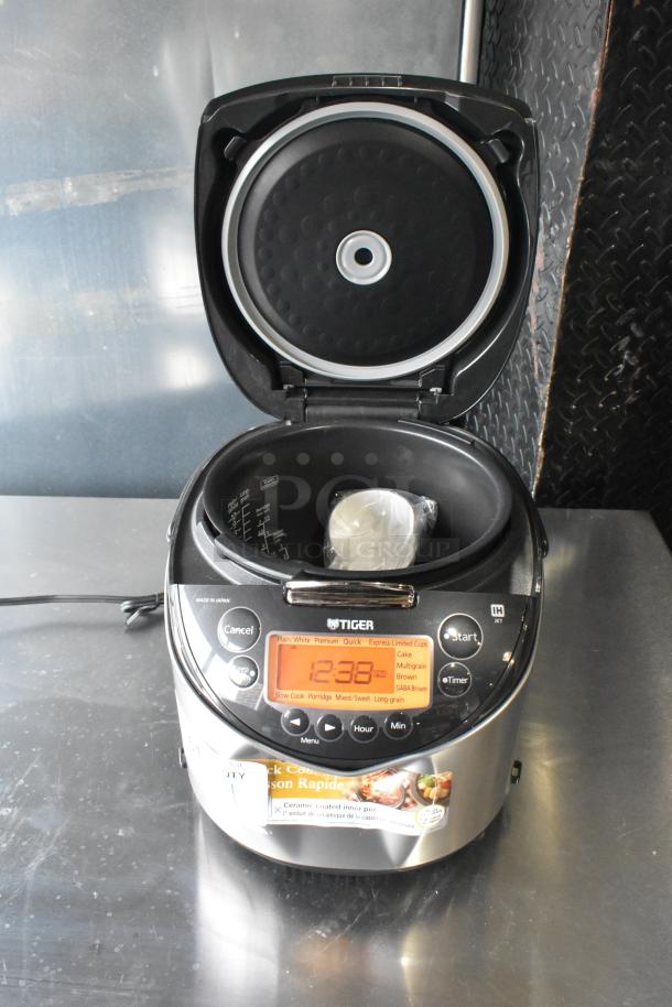 Tiger JKT-D18U countertop rice cooker/warmer, lid open. Display shows 12:33. Lid does not close. 120 volts, 1 phase.