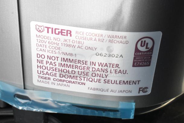 Tiger JKT-D18U rice cooker/warmer, lid issue, 120V, UL certified, warning label visible, made in Japan.