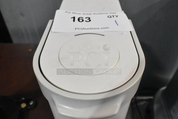 2024 Keurig Single Cup Coffee Maker in white. Visible auction tag. Model features 120 volts, 1 phase, good condition.