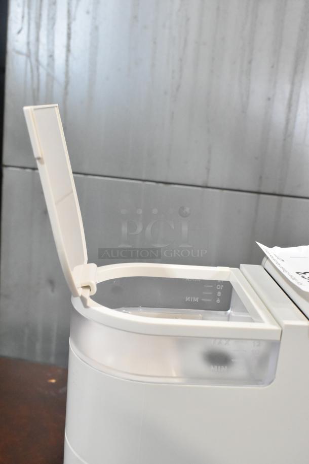 2024 Keurig Single Cup Coffee Maker, open lid, white, 120 volts, water level markers visible.