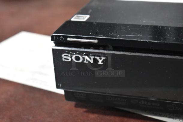 Sony BDP-S560 Blu-Ray Disc DVD Player, black, visible power button, good condition, with surface scratches.