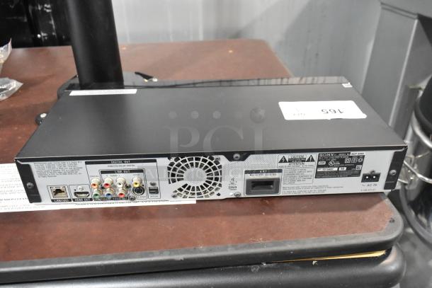 Sony BDP-S560 Blu-Ray Disc DVD Player, rear view. Features HDMI, LAN, various audio/video outputs. Model labeled on back.