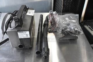 Oreck XL BB880-AD Vacuum Cleaner, 120 Volts, with attachments. Visible label shows model and specs. Good condition.