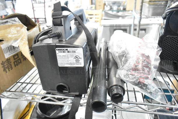 Oreck XL BB880-AD Vacuum Cleaner, 120V, with hose and attachments. Appears gently used with visible labels.