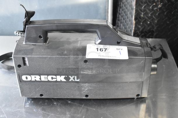 Oreck XL BB880-AD vacuum cleaner, black, 120 volts, portable, visible wear, includes auction tag number 167.