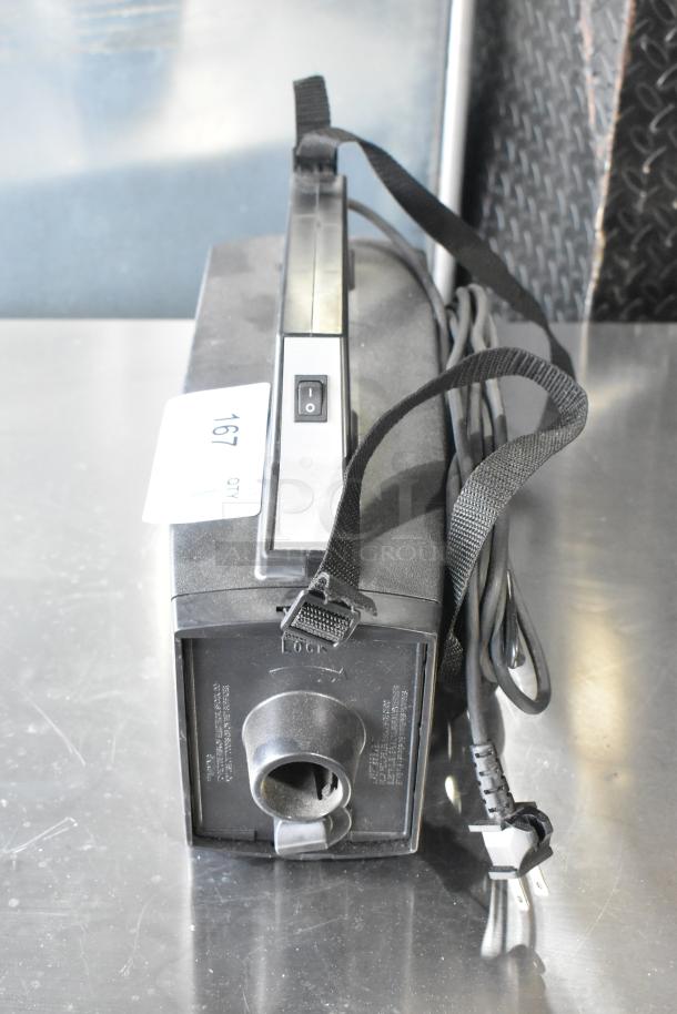 Oreck XL BB880-AD Vacuum Cleaner with strap, 120 volts, 1 phase, visible switch, good condition, model tag shown.
