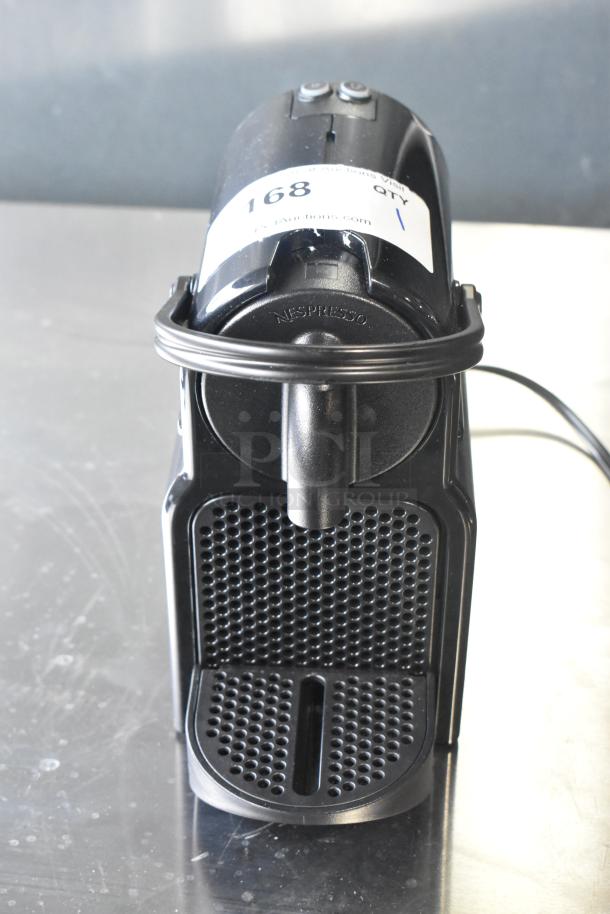 Nespresso SA countertop single cup coffee/espresso machine, 120 volts, Model SA, black finish, with visible item tag.