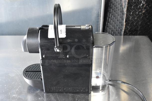 Nespresso SA countertop single cup coffee/espresso machine, black, 120V, 1 Phase, shows minor wear.
