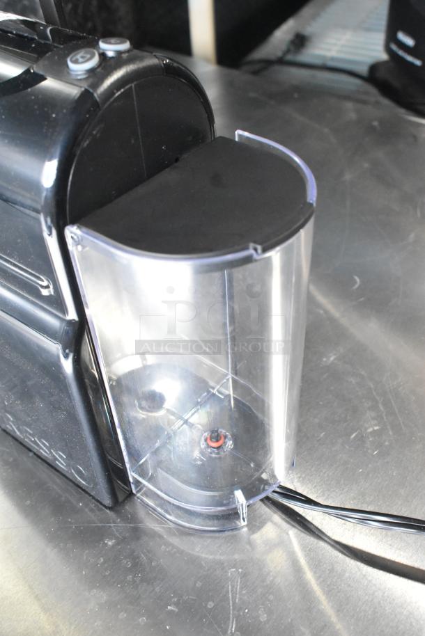 Nespresso SA countertop single cup coffee/espresso machine, 120 volts, 1 phase, black, transparent water tank.