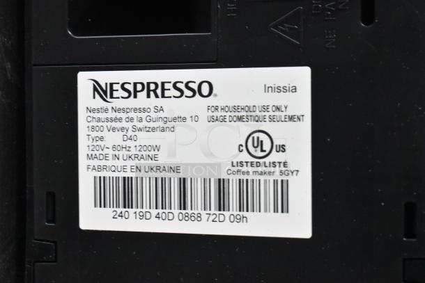Alt Text: Nespresso Inissia coffee machine tag showing model D40, 120V, made in Ukraine, UL listed for household use.