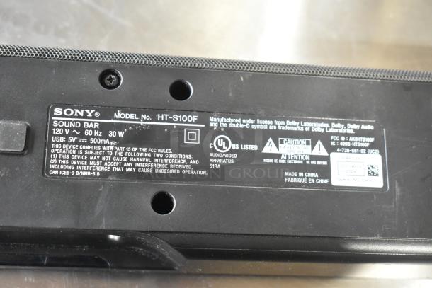 Sony HT-S100F Sound Bar label showing model, 120V, 30W, FCC compliance, UL listed, and warning information.