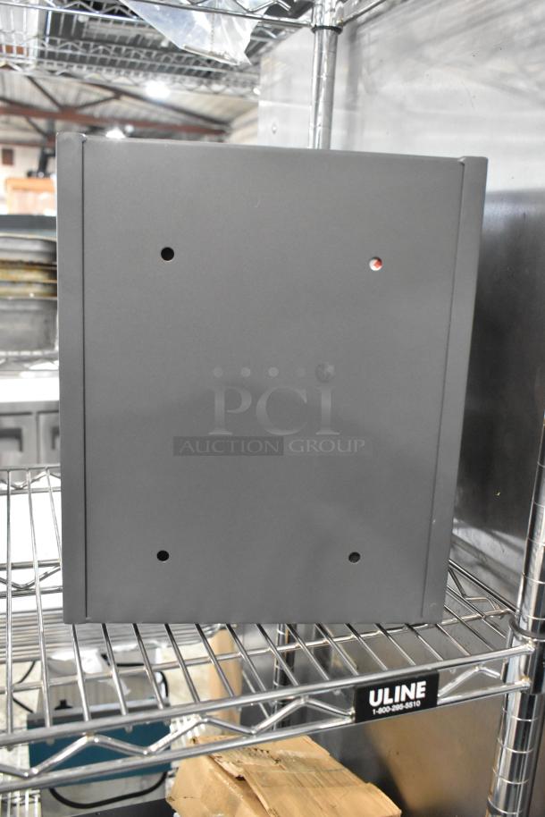 Cabela's gray metal safe, keyless, sturdy build, minor exterior wear, no keys included, ideal for secure storage.