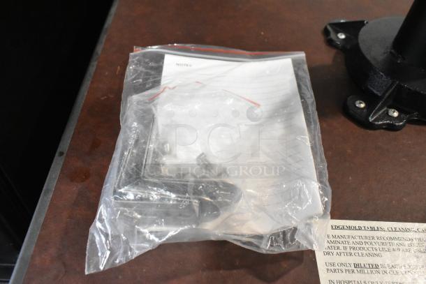 Lifestyle LS-HEAT-BLACK Infrared Electric Patio Heater base, tripod stand visible. Condition appears new, includes mounting hardware.