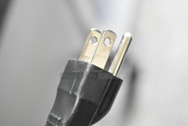 Close-up of a black electric plug of the Lifestyle LS-HEAT-BLACK infrared patio heater. 120 volts, 1 phase.