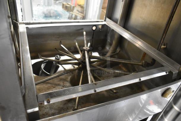 Jackson stainless steel commercial pass-through dishwasher, pristine condition; features durable internal spray arms.