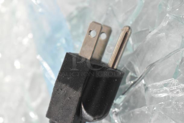 Avantco 19BCR15HCW plug amid broken glass, highlighting damage on display case; 110V, 1 Phase.