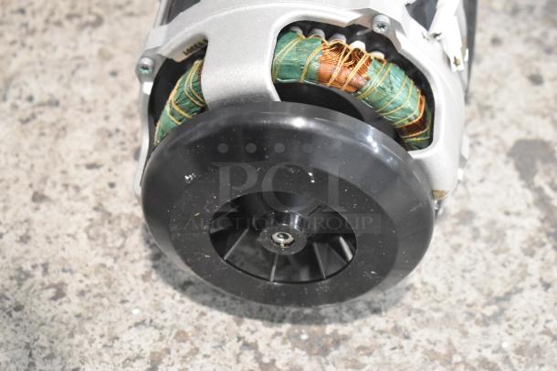 Brand new Nidec D29R/T motor, 120V, 1 phase, visible coil wiring, minor scratches, black fan casing.
